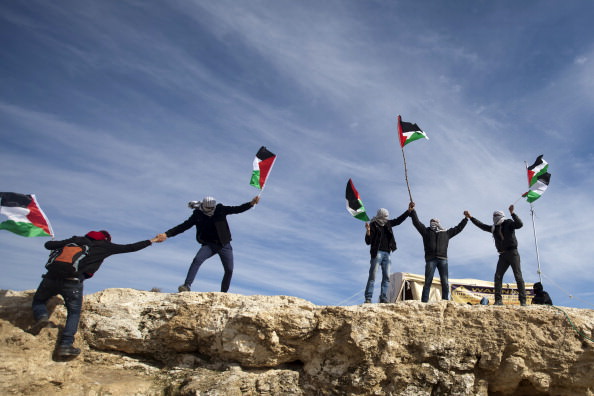 Palestinian flags Bab al Shams.jpg