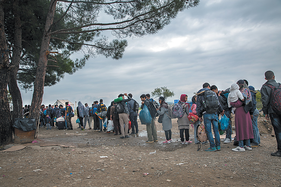 Refugees and migrants waiting to cross the border from Greece to Macedonia, October 2015