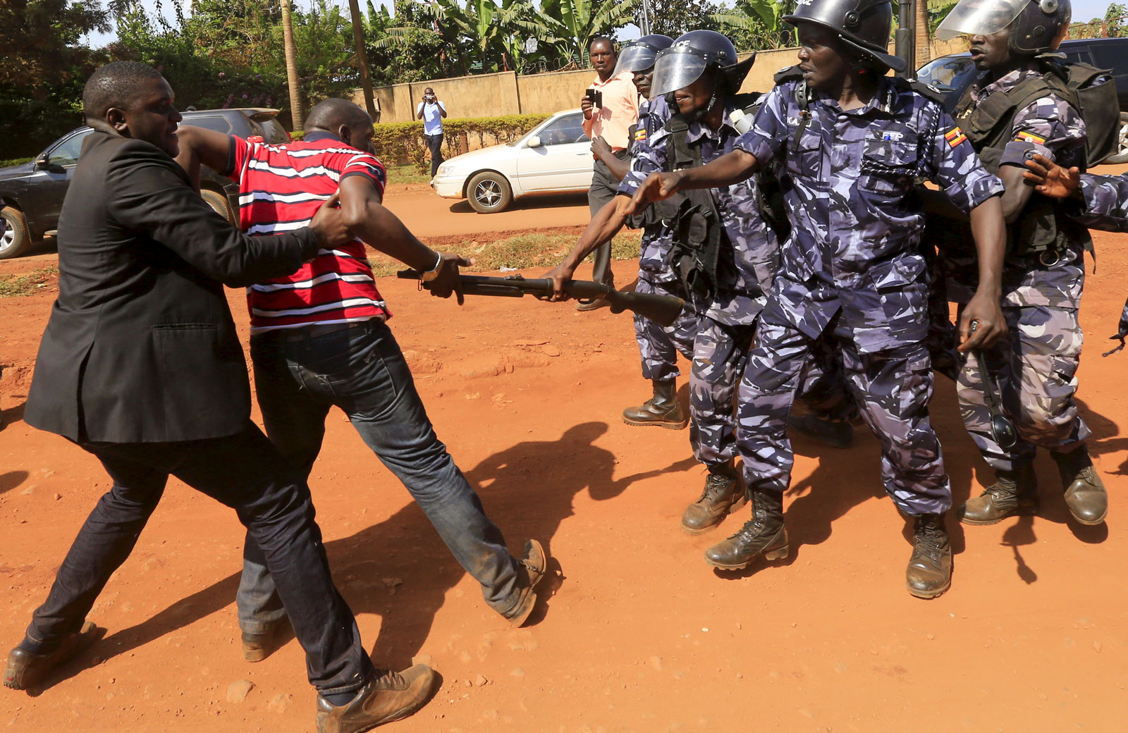 Riot police dispersing a gathering of opposition supporters in Jinja, eastern Uganda, September 10, 2015