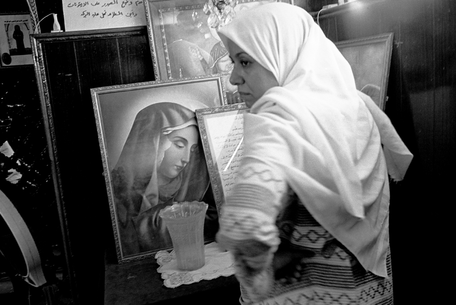 A Muslim woman asking for protection from black magic inside the shrine of Abba Ruwais, a Copt saint, Cairo, Egypt, 1997