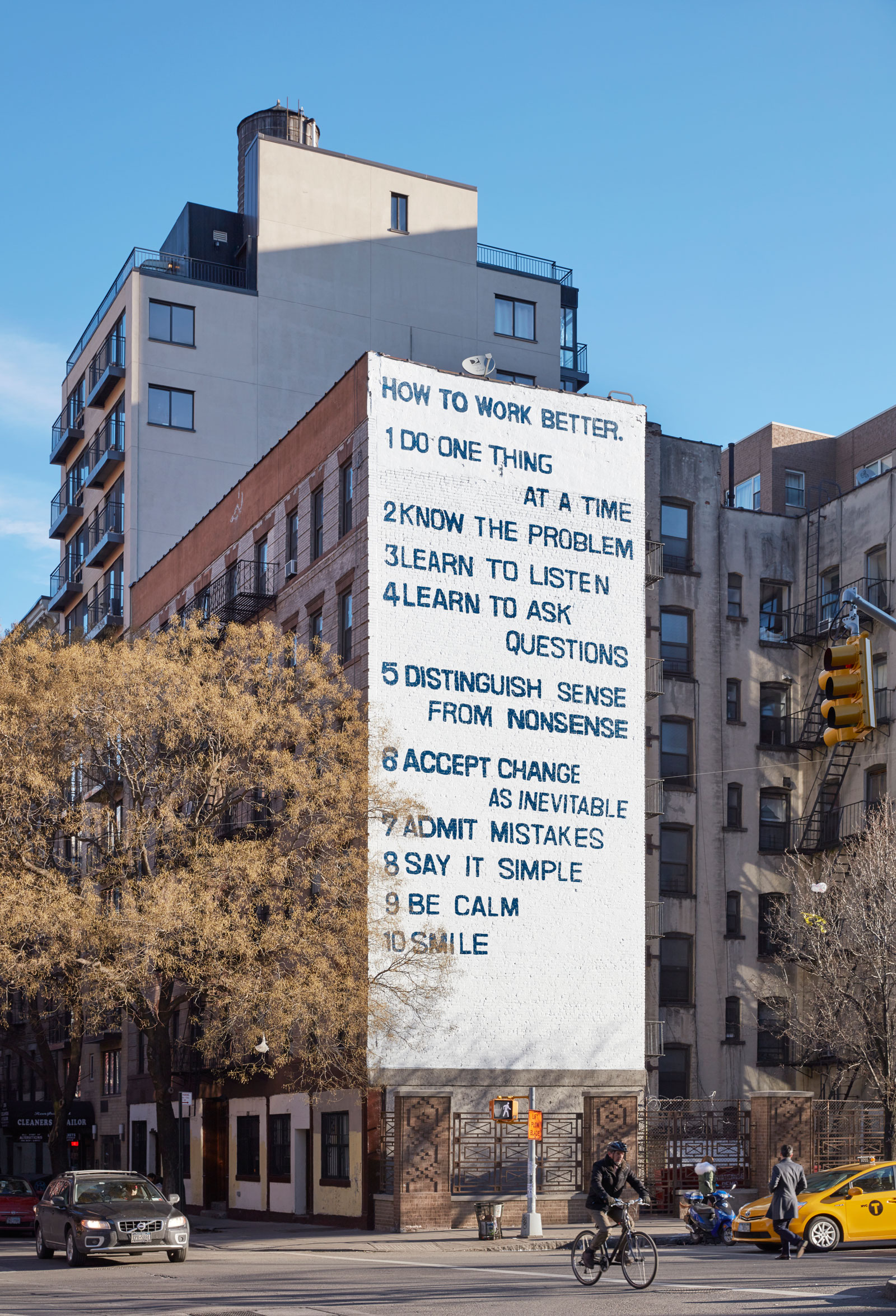 Peter Fischli and David Weiss's "How to Work Better" mural, on the corner of Houston and Mott Streets, New York City, 2016