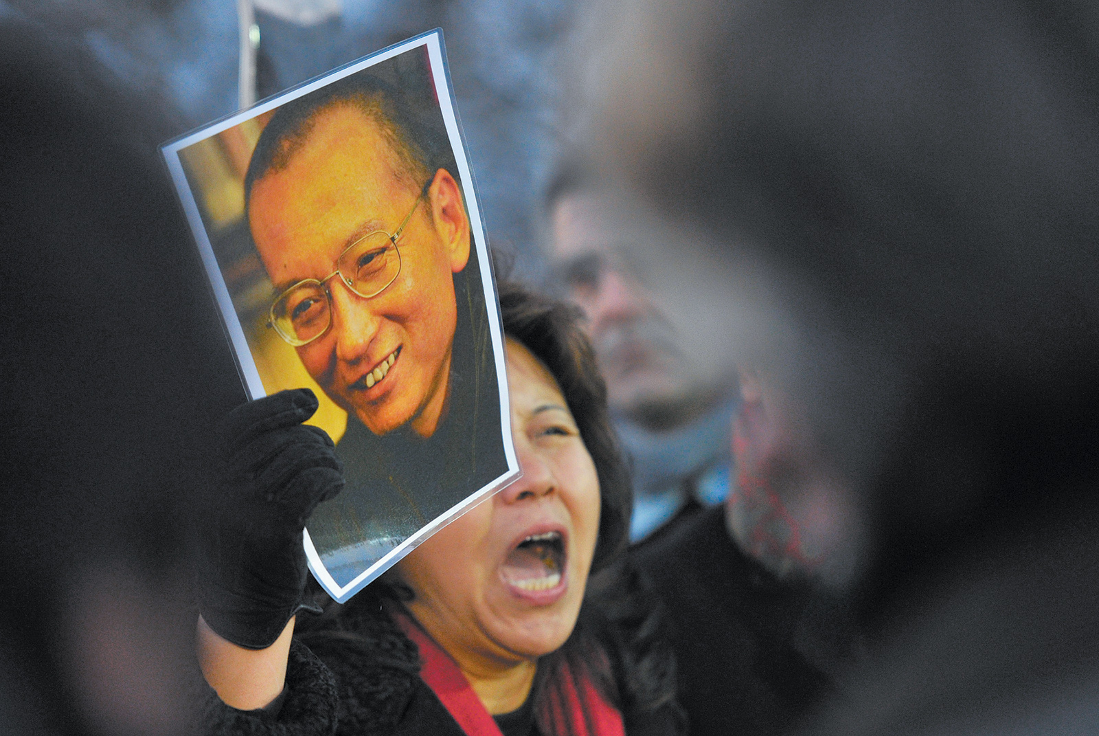 A protester holding an image of the imprisoned Chinese poet and Nobel Peace Prize laureate Liu Xiaobo, Oslo, December 2010