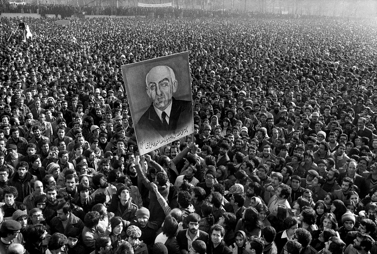 Protesters at Tehran University with a portrait of Mohammad Mossadegh during the Iranian Revolution, January 1979