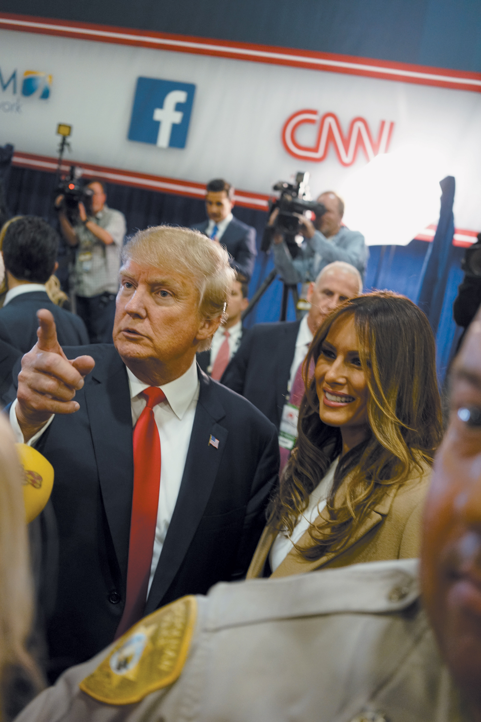 Donald and Melania Trump with reporters in the spin room after the Republican presidential debate in Las Vegas, December 2015