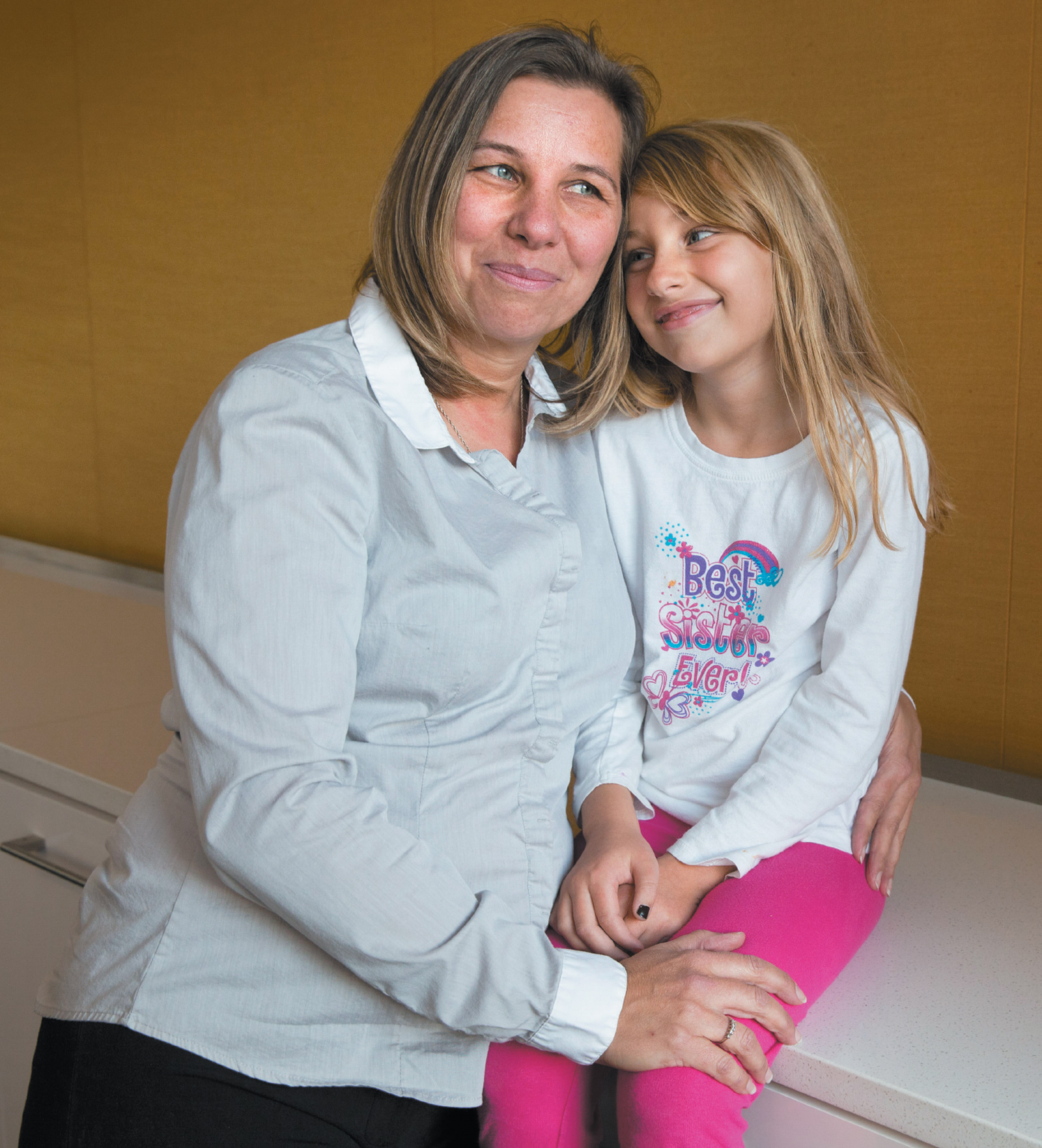Peggy Young, a former UPS employee who lost her health insurance when the company refused her temporary medical request to avoid lifting heavy packages during her pregnancy, with her daughter Triniti, who was seven years old when Young’s case finally reached the Supreme Court, Washington, D.C., November 2014