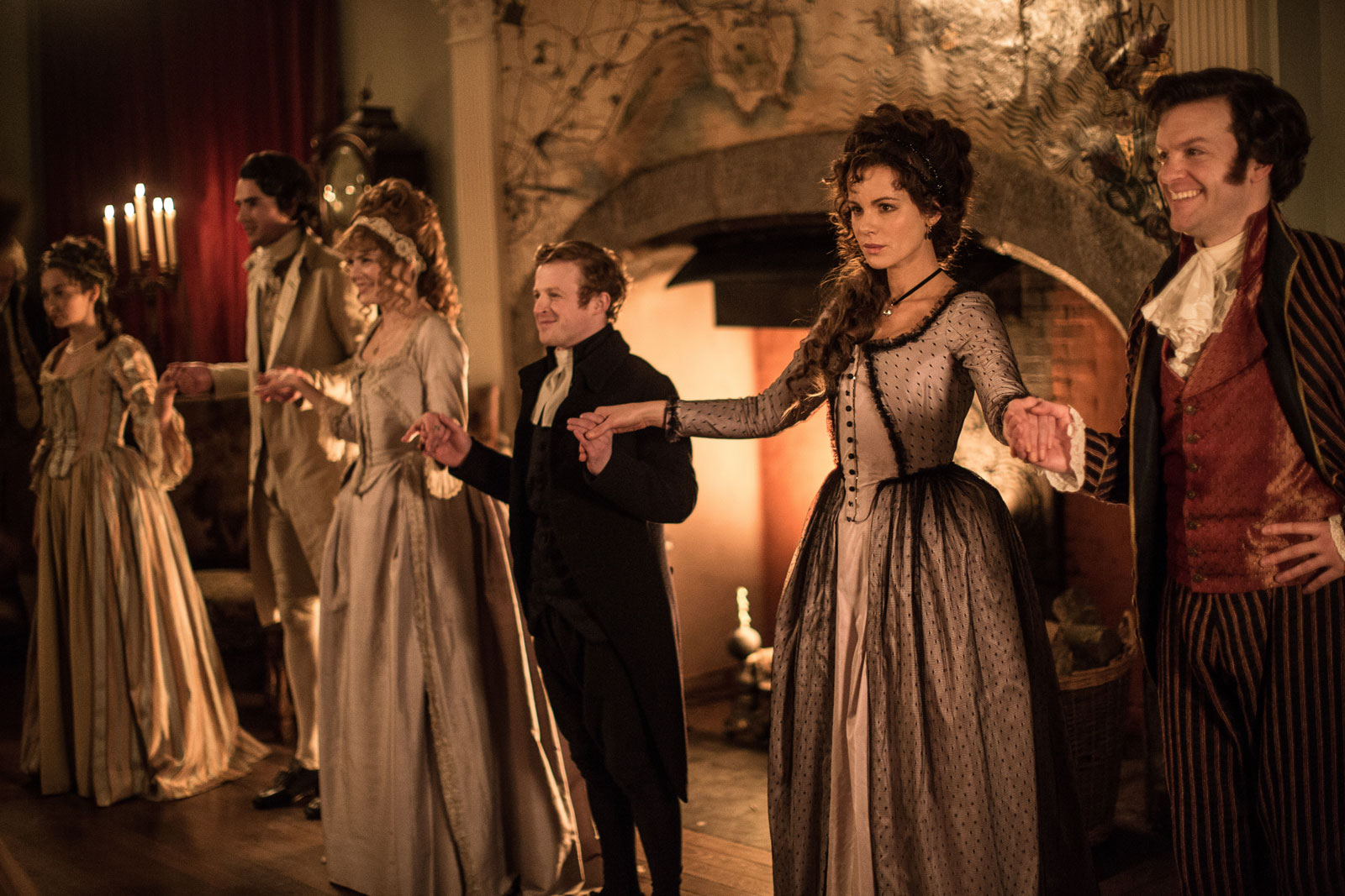 Kate Beckinsale as Lady Susan Vernon (right) and Tom Bennett as Sir James Martin (far right) in Whit Stillman's <em>Love &amp; Friendship</em>, 2016