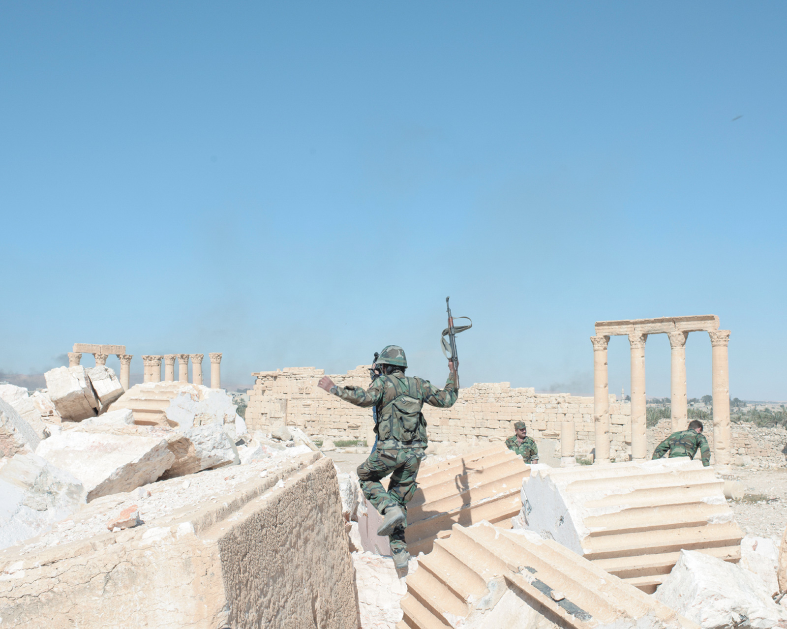 Syrian Army soldiers at the ruins of the Temple of Bel after retaking the destroyed ancient city of Palmyra from Islamic State militants, April 2016