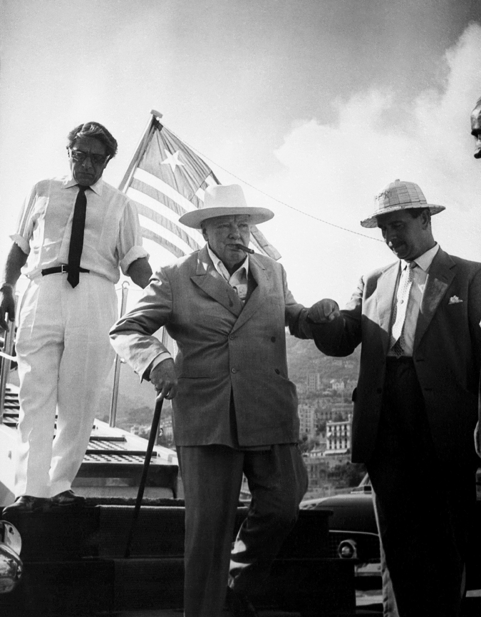 Winston Churchill being helped off Aristotle Onassis’s yacht Christina by Onassis (left) and Churchill’s bodyguard Edmund Murray, August 1959