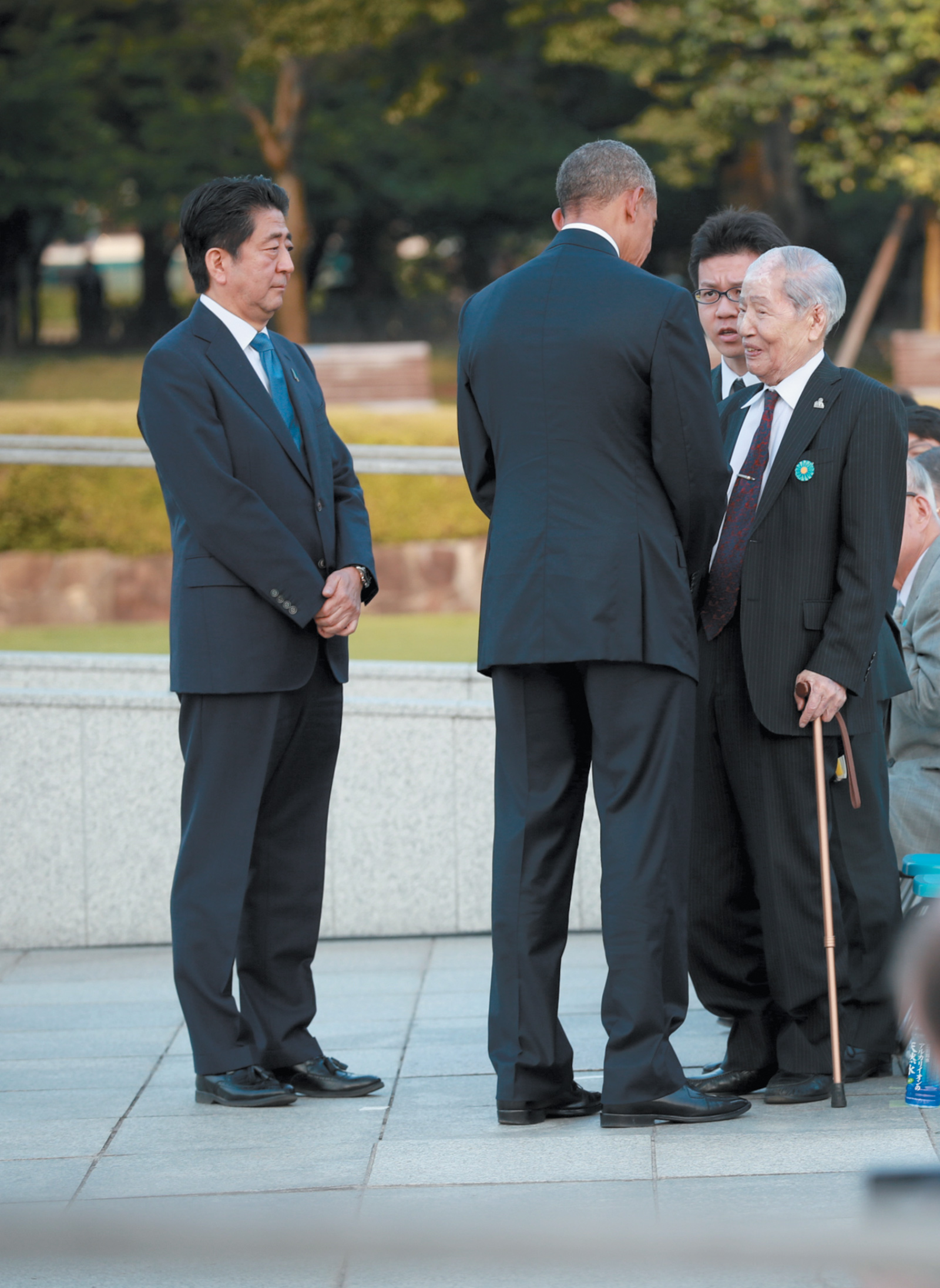 President Obama with Sunao Tsuboi, a survivor of the US’s atomic bombing of Hiroshima in 1945, during a ceremony at the Hiroshima Peace Memorial, May 2016. Japanese Prime Minister Shinzo Abe is at left.