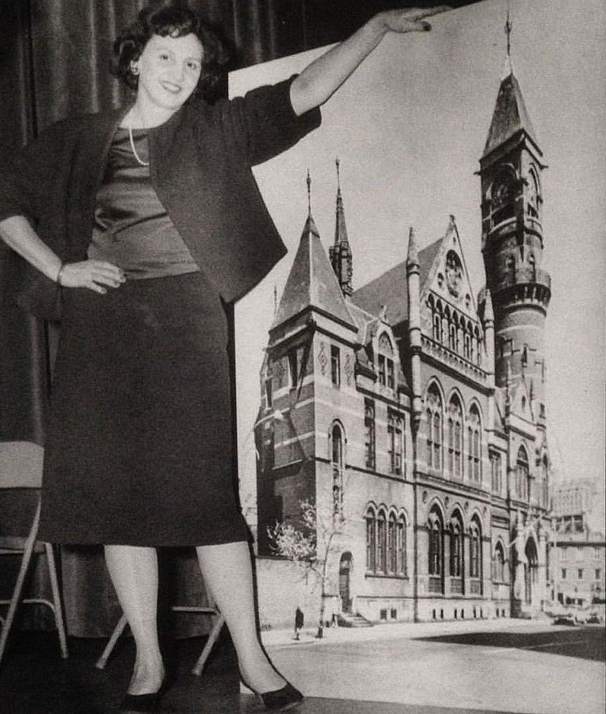 Margot Gayle in 1960 with a photo of Manhattan's Jefferson Market Courthouse, which she helped save from destruction. It is now a branch of the New York Public Library.