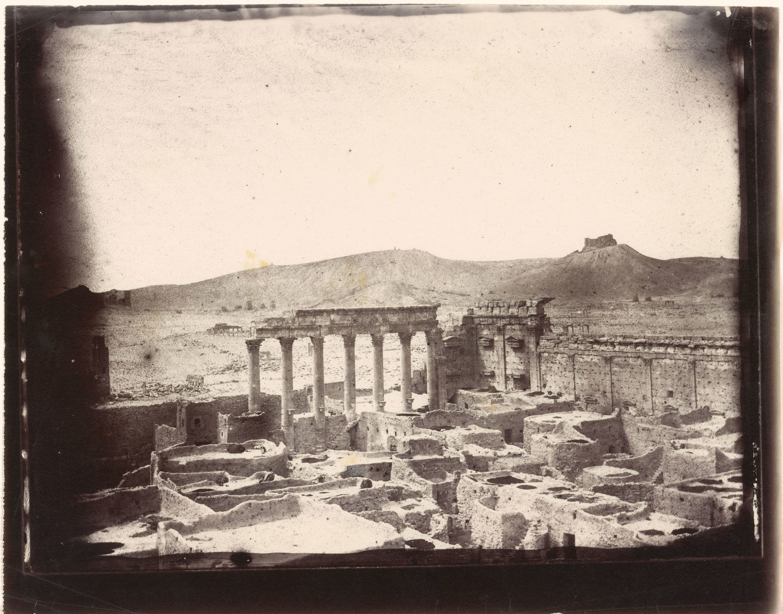 The northwest corner of the courtyard of the Temple of Bel, Palmyra, photographed by Louis Vines, 1864