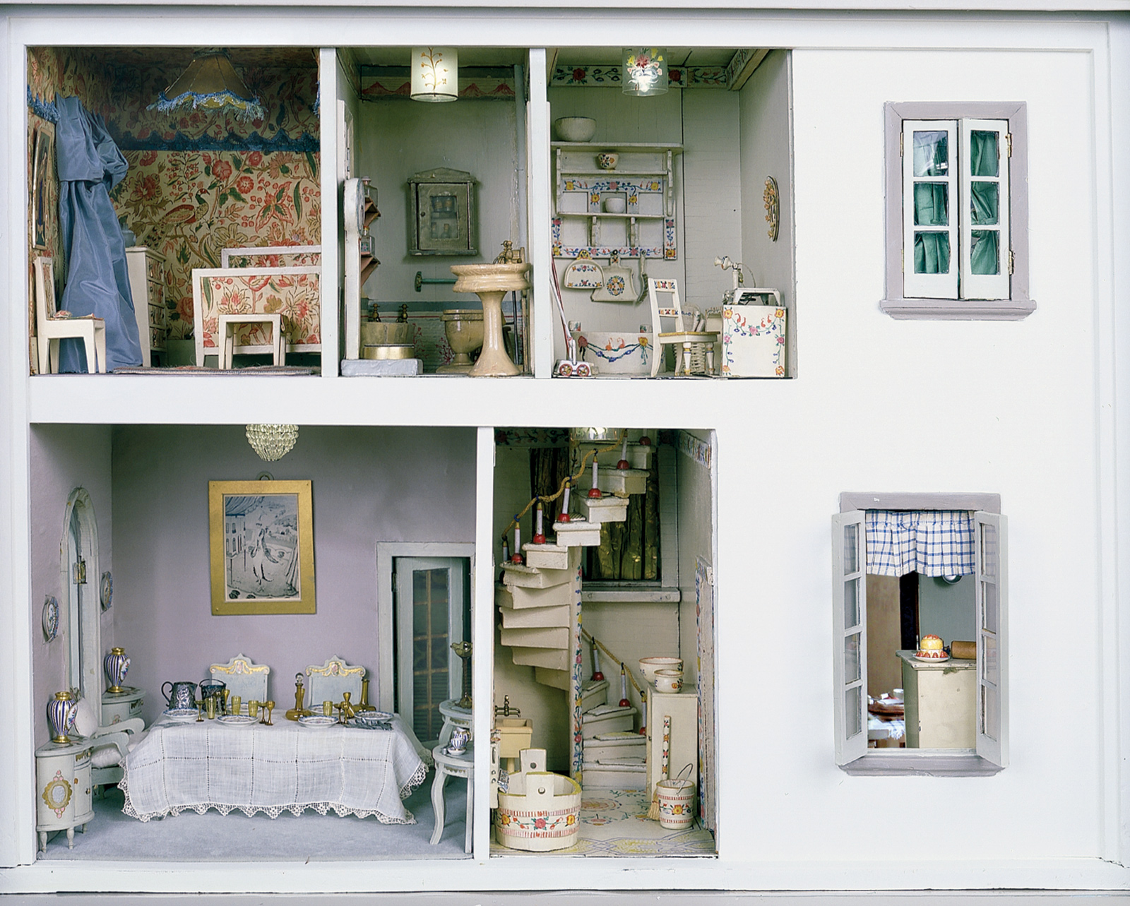 The left side of the Stettheimer Dollhouse, created by Carrie Walter Stettheimer, 1916­–1935. Clockwise from top left are the Chintz Bedroom, the Green Bathroom, the Upper and Lower Backstairs, and the Dining Room; from The Stettheimer Dollhouse at the Museum of the City of New York, published by Pomegranate Communications.