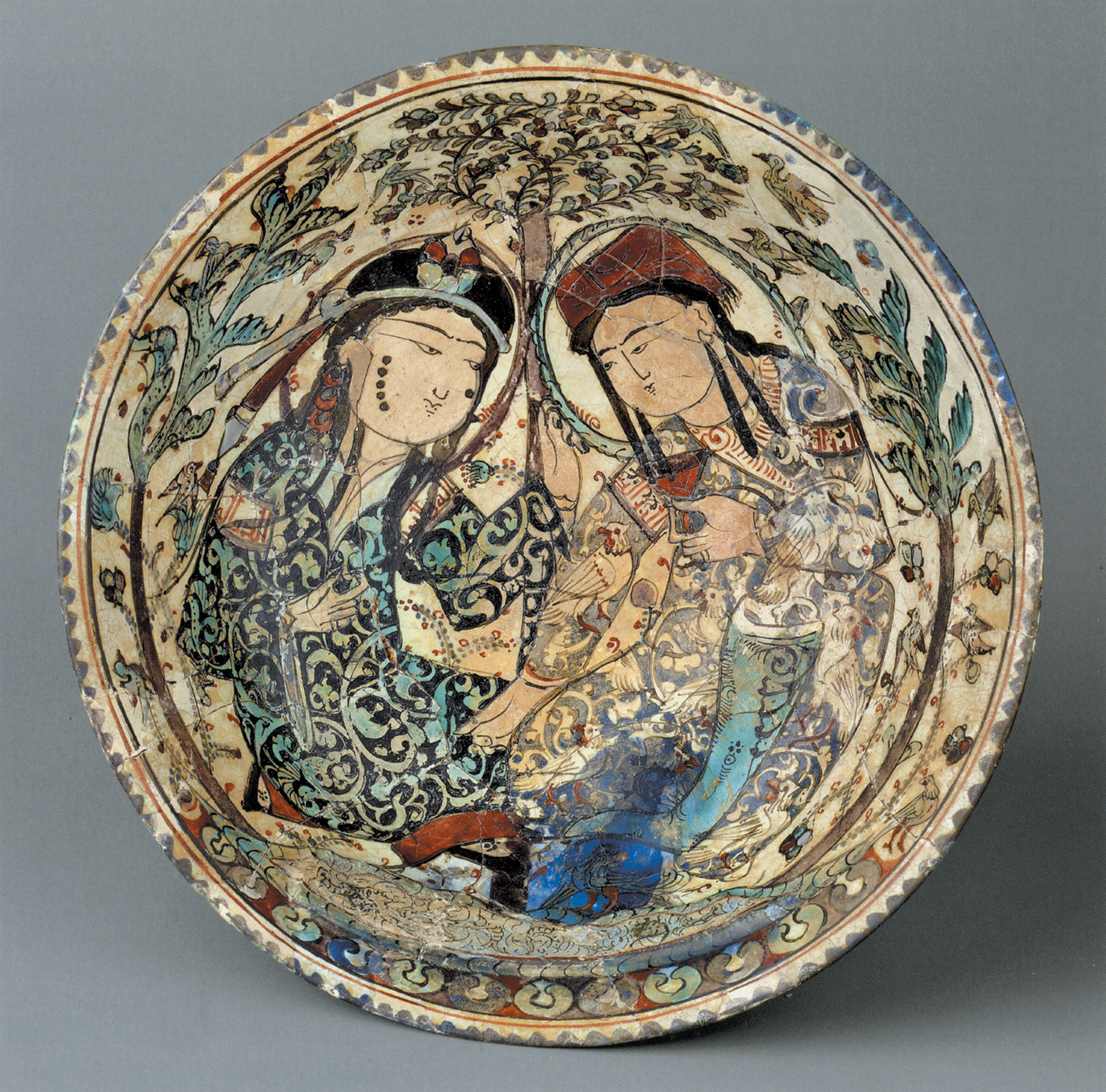 ‘Bowl with Couple in a Garden’; stonepaste plate, Iran, late twelfth–early thirteenth century