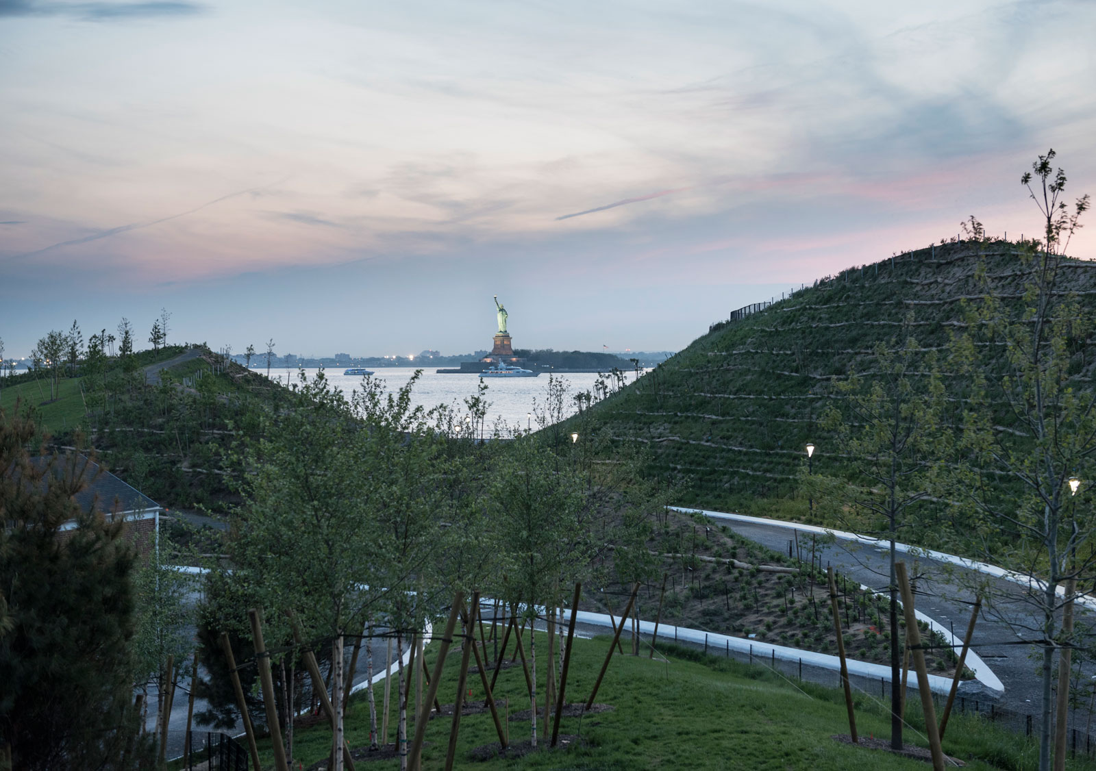 West 8's man-made Discovery and Outlook Hills, with the Statue of Liberty in the distance, Governors Island, New York, 2016