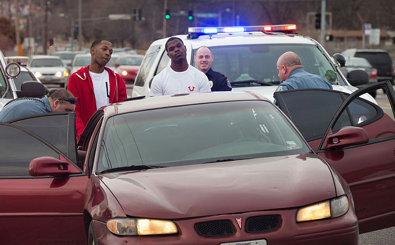 Police search a vehicle, Ferguson, Missouri, March 14, 2015