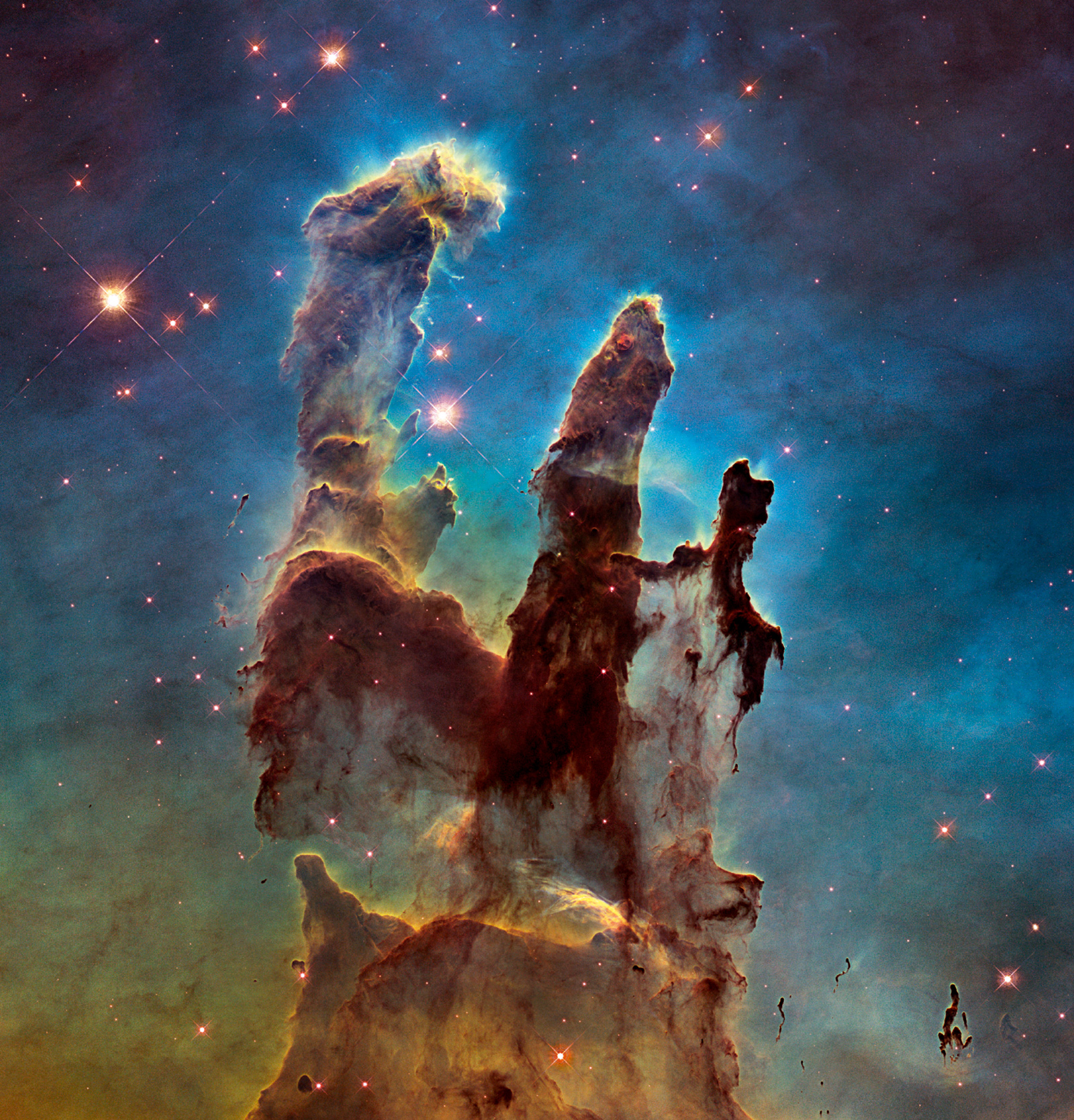 The Pillars of Creation inside the Eagle Nebula, a cloud of interstellar gas and dust about 6,500 light years away from Earth; from Expanding Universe: Photographs from the Hubble Space Telescope, published by Taschen last year on the twenty-fifth anniversary of the Hubble launch