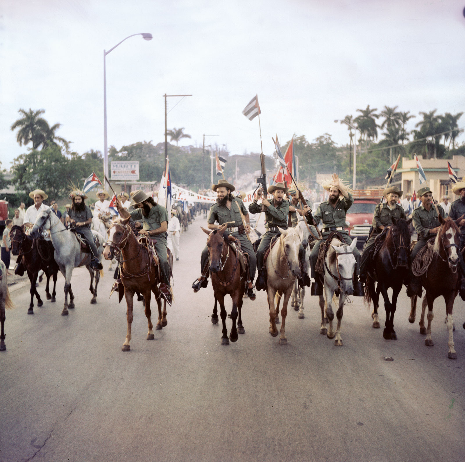 Seven years after the start of the revolution, rebel army leader Camilo Cienfuegos, center, and his fellow "barbudos" approaching Havana, 1959