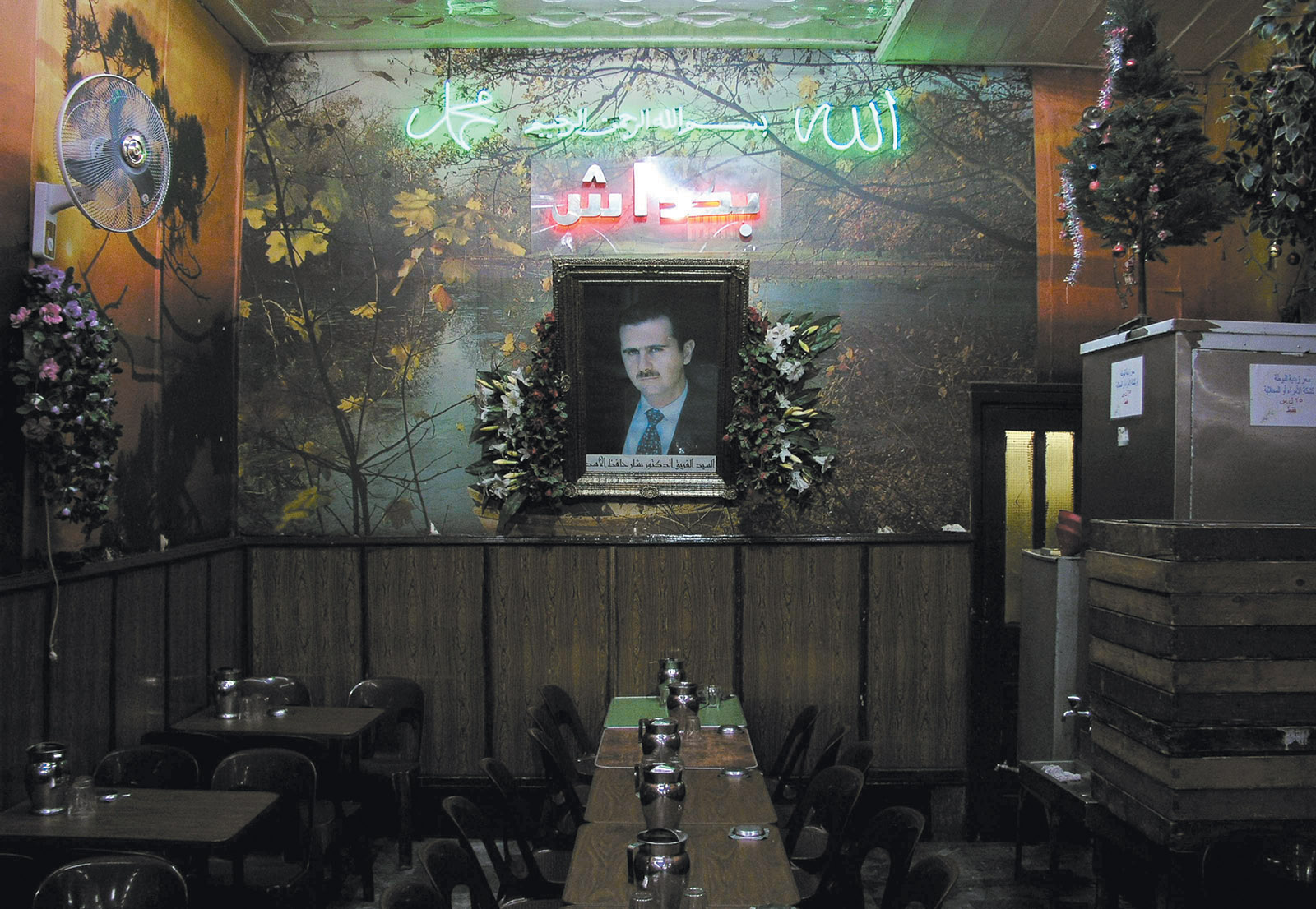 A portrait of Syrian President Bashar al-Assad in a café in Damascus at the time of the US-led invasion of Iraq, March 2003