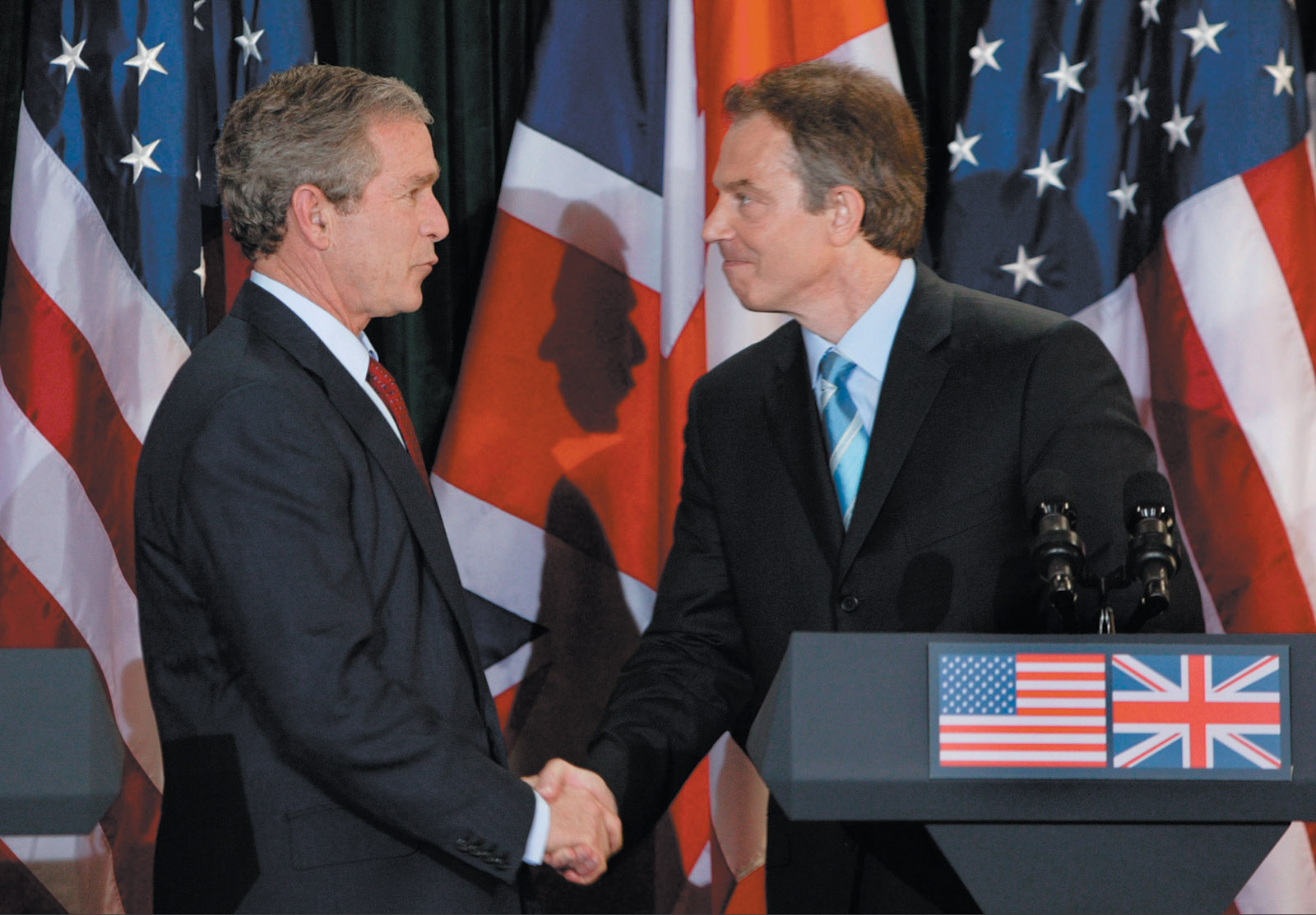George W. Bush and Tony Blair at a joint press conference at Hillsborough Castle, near Belfast, Northern Ireland, April 2003