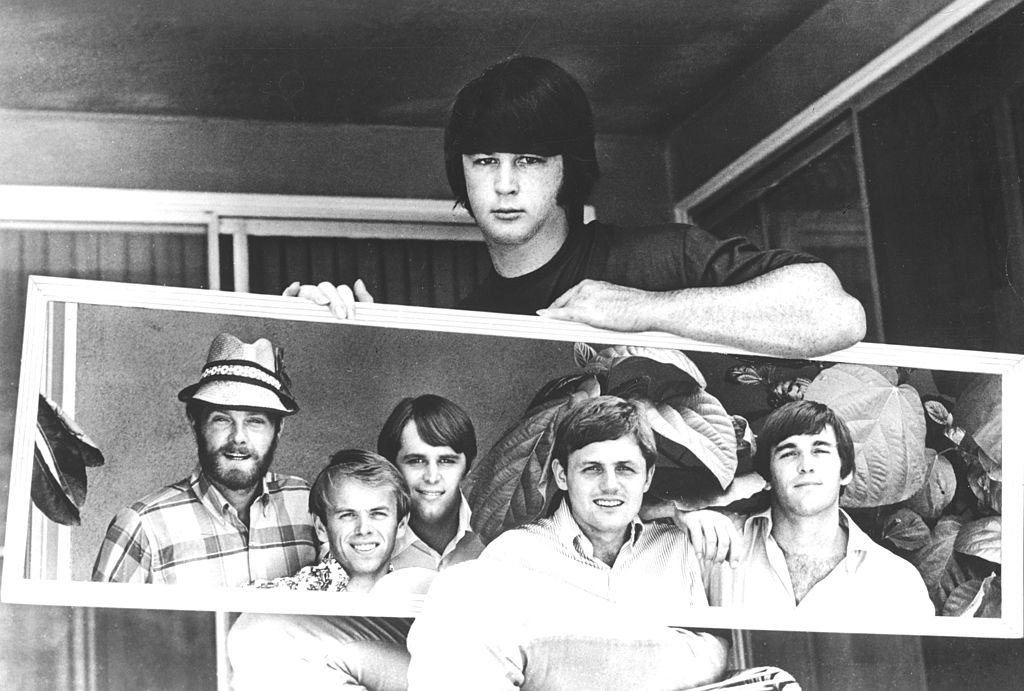 Mike Love, Al Jardine, Carl Wilson, Bruce Johnston, and Dennis Wilson, reflected in a mirror held by Brian Wilson, circa 1967