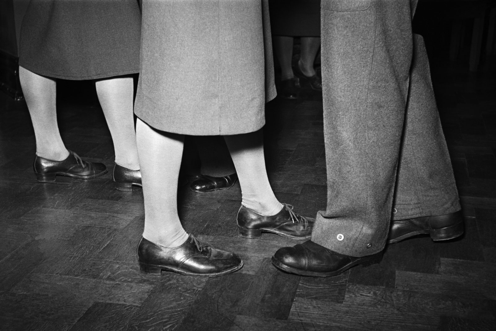 Utility footwear worn on a wartime evening out, London, 1940
