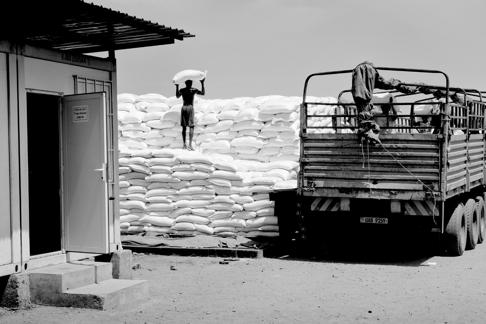 A worker stacking bags of grain at the World Food Programme warehouses in Juba, South Sudan, March 2016