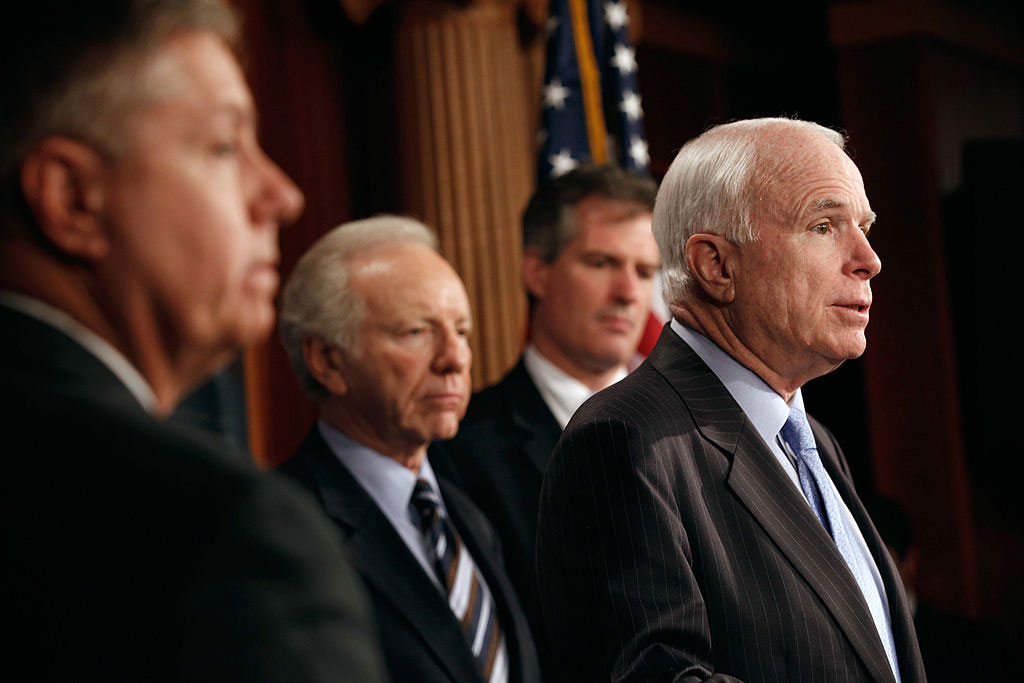 Senator John McCain (right) with fellow senators Lindsey Graham, Joe Lieberman, and Scott Brown, introducing legislation to refine the Detainee Treatment Act of 2005, Washington, DC, March 10, 2011