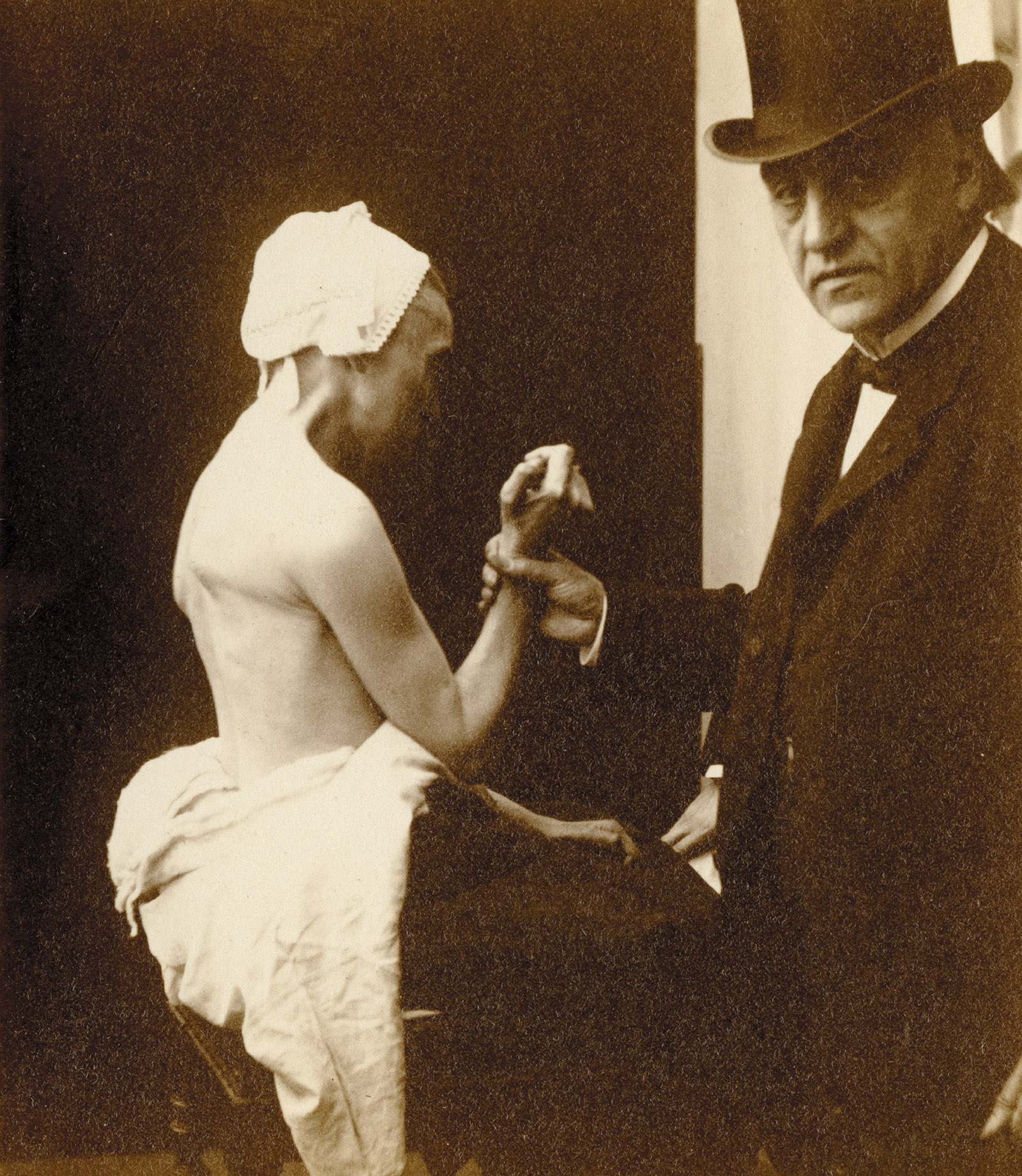 The neurologist Jean-Martin Charcot holding the arm of a female patient suffering from locomotor ataxia, Hôpital Salpêtrière, Paris, circa 1885