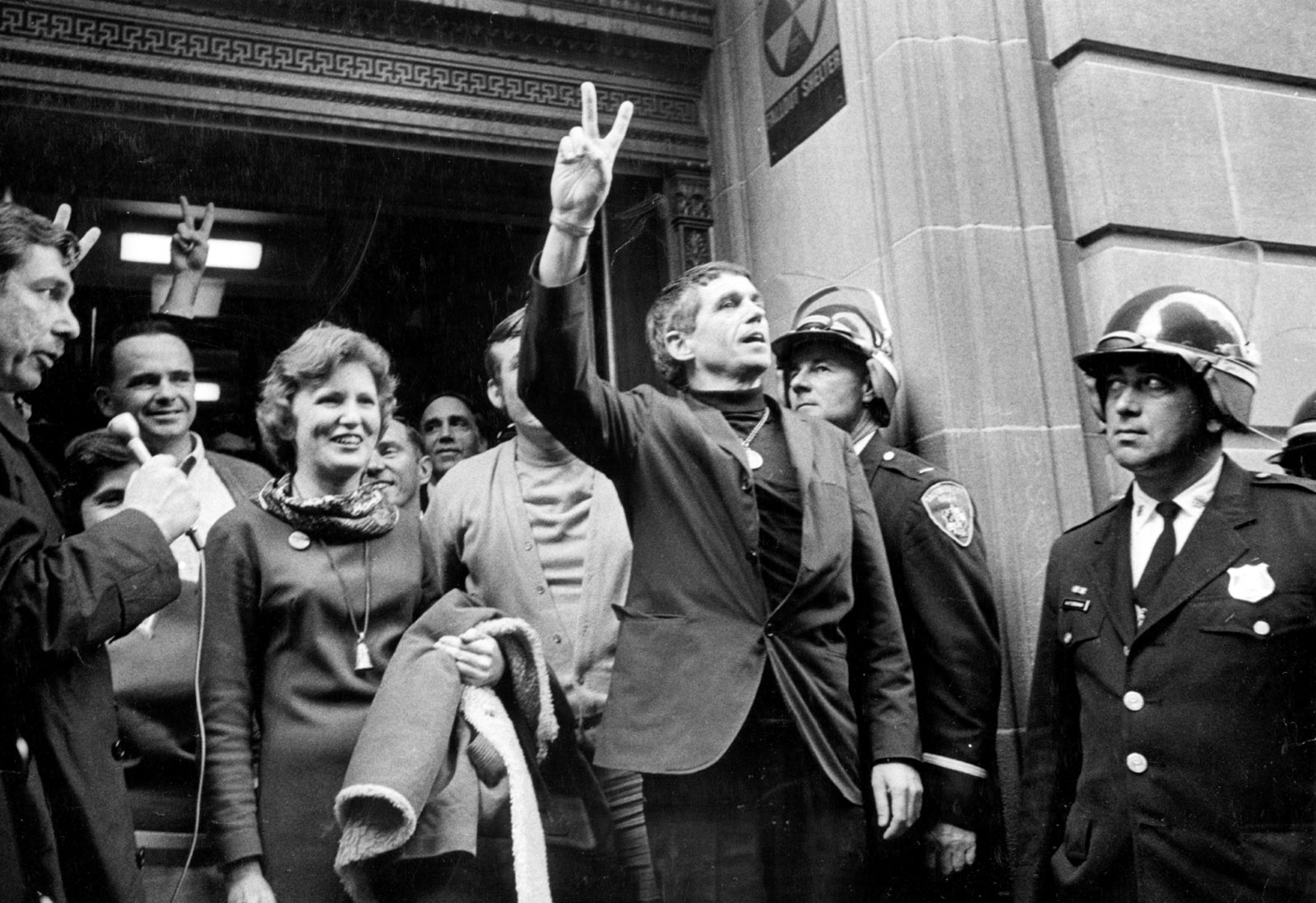Catonsville Nine members Mary Moylan and Daniel Berrigan leaving the Baltimore federal courthouse at the time of their trial for burning draft files to protest the Vietnam War, October 1968
