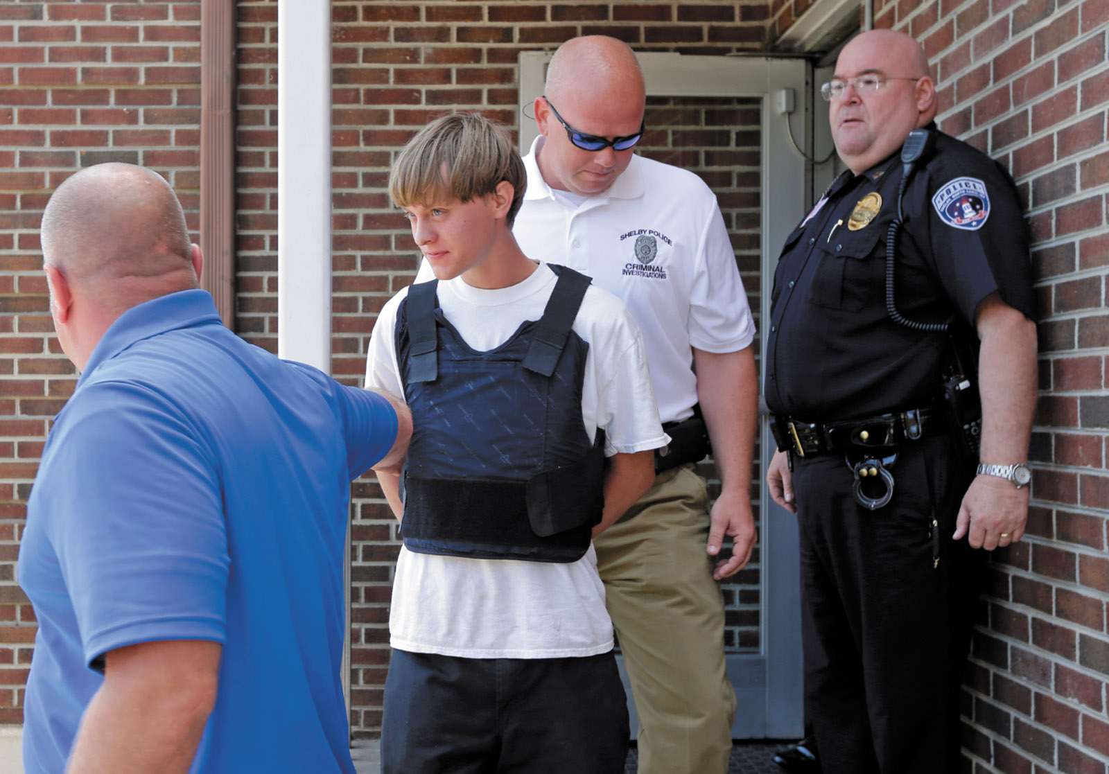 Dylann Roof being escorted from the Shelby Police Department after his arrest, Shelby, North Carolina, June 2015