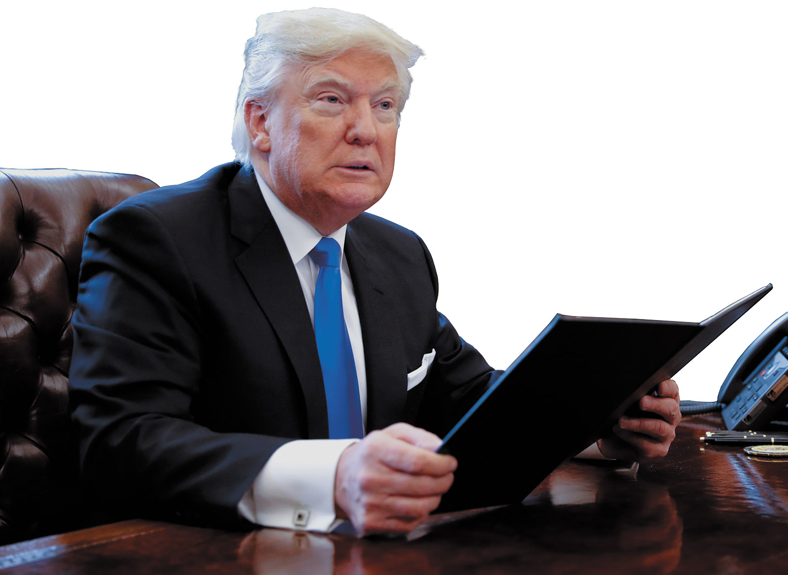 President Trump in the Oval Office, signing an executive order on oil pipelines, January 2017