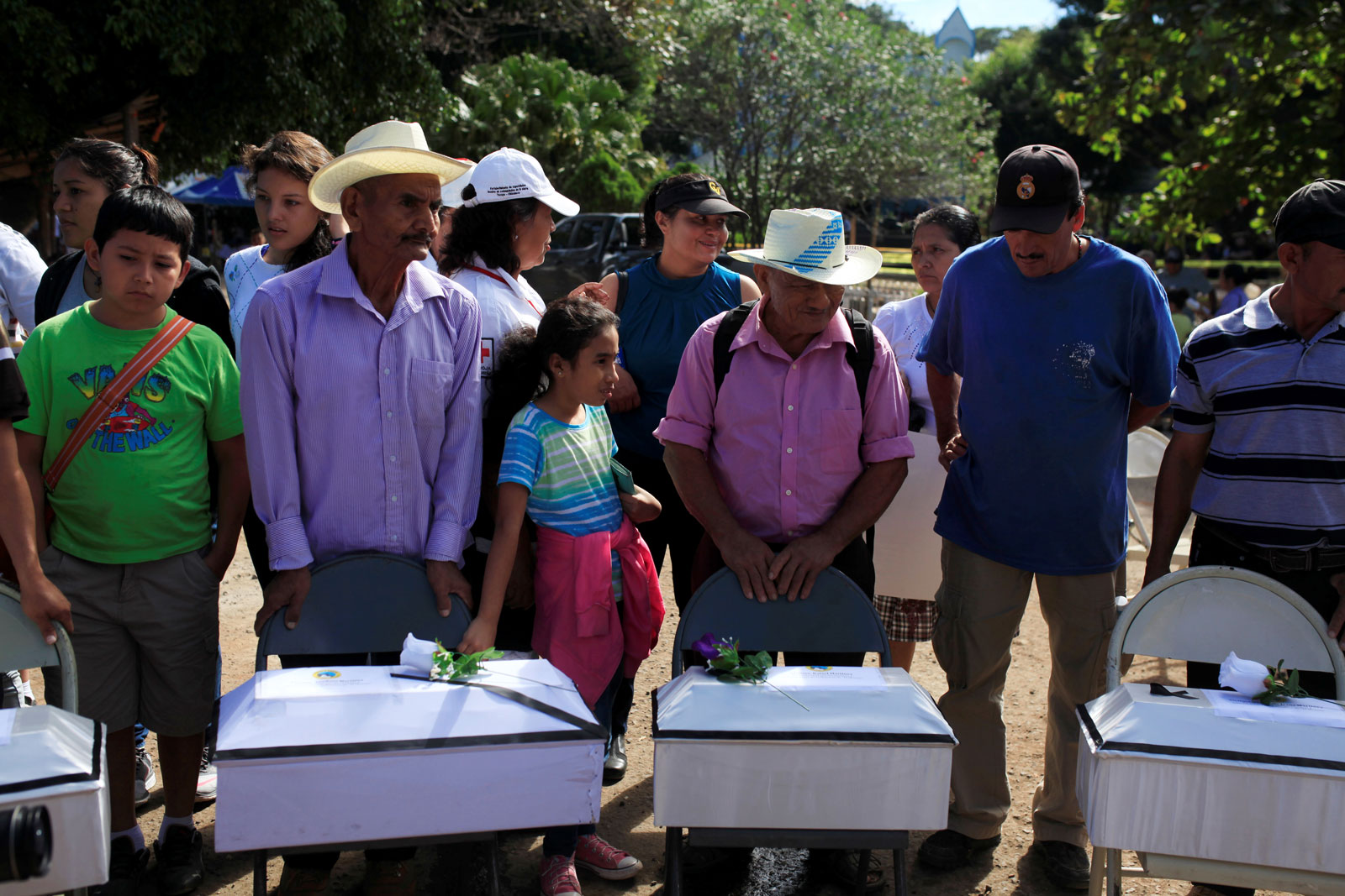 Families of those killed at the El Mozote massacre, with the unearthed remains of the victims, El Mozote, El Salvador, December 10, 2016