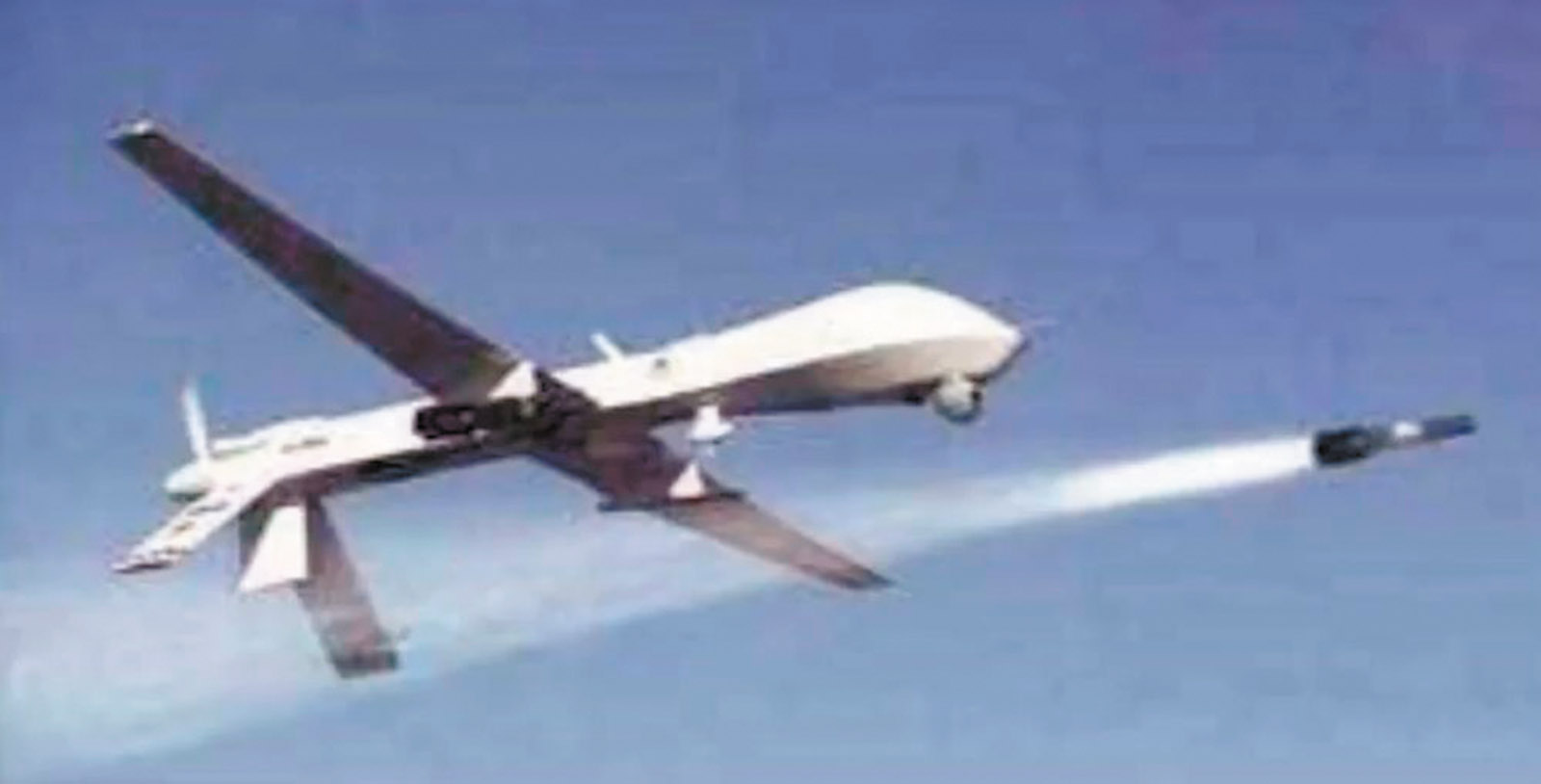 A US Predator drone firing a Hellfire missile