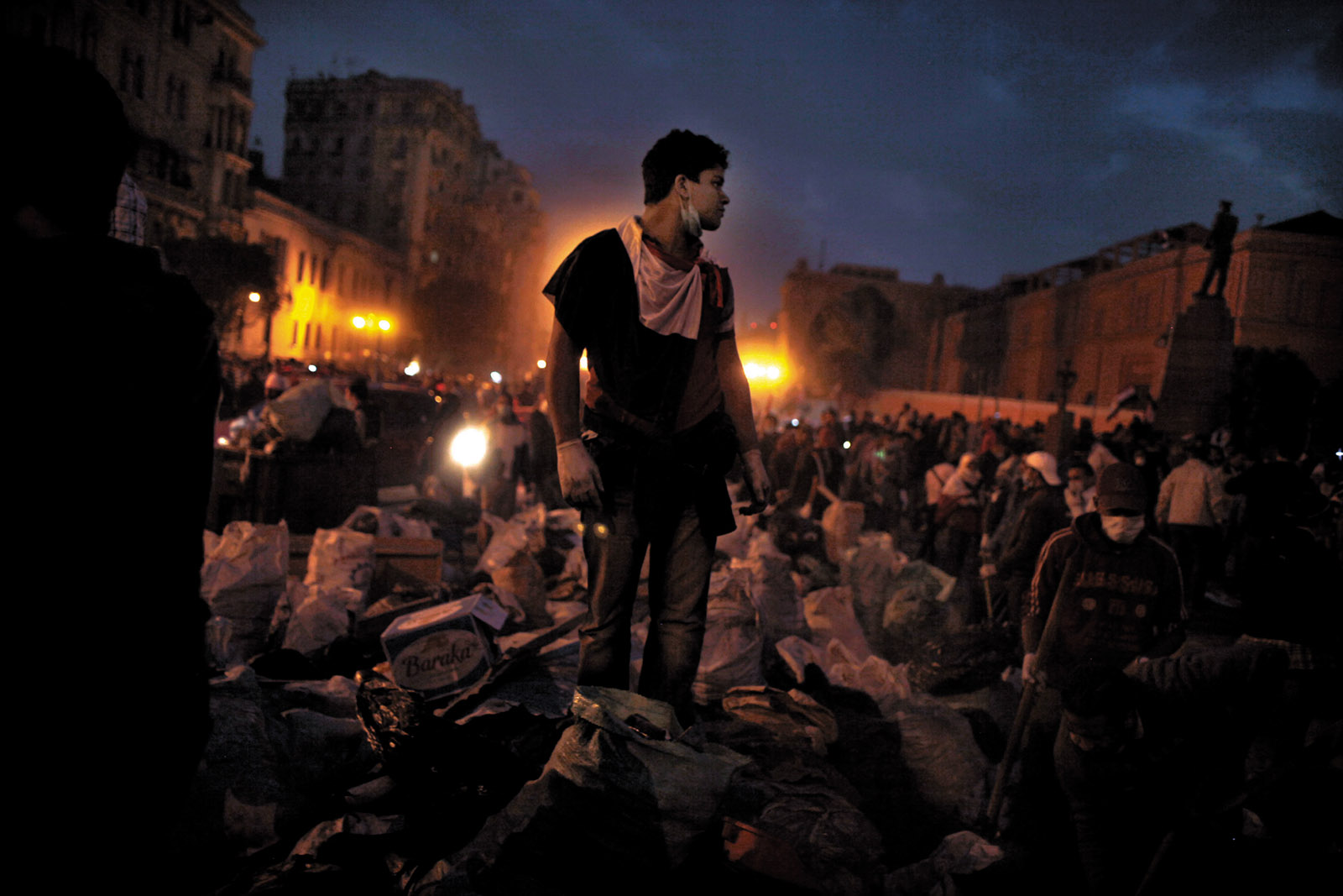 Volunteers clearing trash and debris from Tahrir Square, Cairo, February 2011