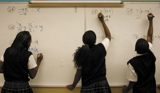 Eighth-grade students working out algebra problems at Robert Treat Academy, a charter school in Newark, New Jersey, September 16, 2008
