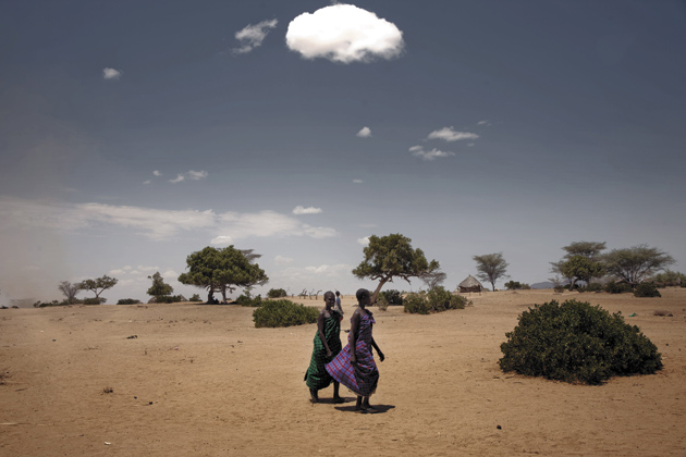 Young women walking to a food relief center in the drought-stricken village of Nadapal, Rift Valley province, Kenya, October 2, 2009; photograph by Stefano De Luigi

