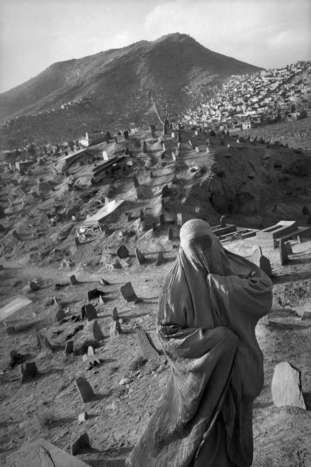 An Afghan woman at a Shiite cemetery in Kabul, 2001; photograph by Abbas from In Whose Name? The Islamic World After 9/11, a collection of his recent images from Afghanistan, Iraq, Iran, and other countries, just published by Thames and Hudson
