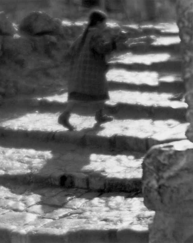 Child backlit on steps, 1920s, by the Hungarian photographer Martin Munkacsi