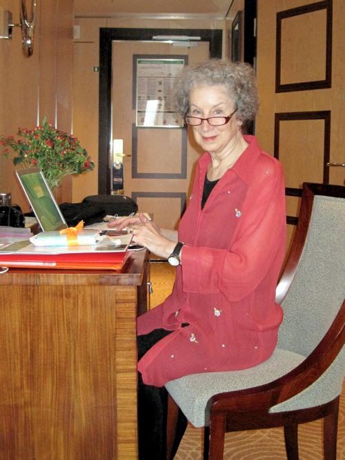 Margaret Atwood seated in a chair on the Queen Mary 2