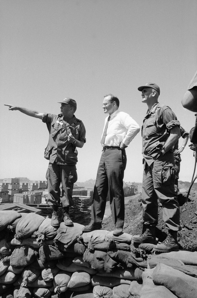From left, Lieutenant Colonel John C. Hughes briefing McGeorge Bundy and General William C. Westmoreland on the recent Vietcong attack on Pleiku, South Vietnam, February 10, 1965
