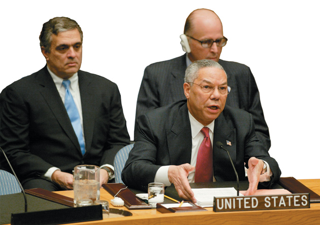 Secretary of State Colin Powell at the UN Security Council presenting evidence of Iraqi WMDs, with CIA Director George Tenet and US Ambassador to the UN John Negroponte,  February 5, 2003
