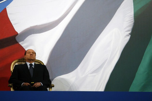 Italian Prime Minister Silvio Berlusconi, during a speech by Libyan leader Muammar Qaddafi at Italian military police headquarters, Rome, August 30, 2010
