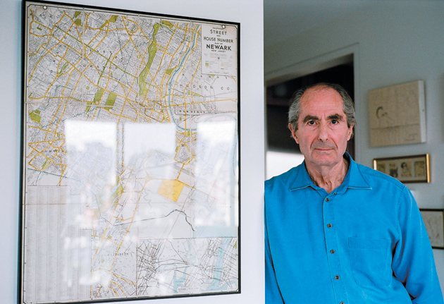 Philip Roth in New York City with an old map of Newark, 2007
