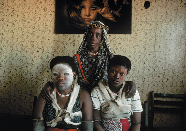 A sangoma, or traditional healer, with her apprentices, Soweto, South Africa, 1981
