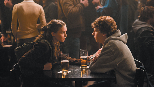 Jesse Eisenberg as Mark Zuckerberg, the founder of Facebook, and Rooney Mara as his girlfriend Erica in The Social Network
