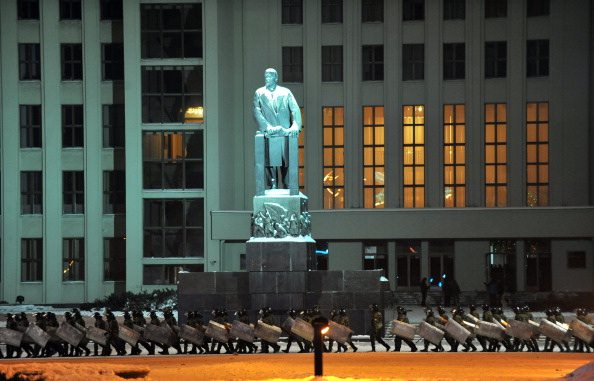 Riot policemen standing guard around a government building during an opposition rally in Independence Square, Minsk, December 20, 2010