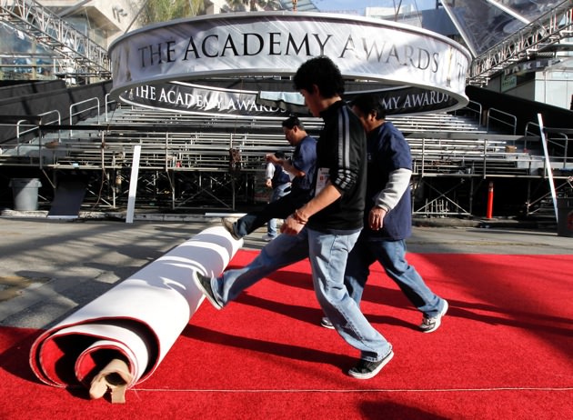 Workers rolling out the red carpet at the Kodak Theatre, Los Angeles, February 23, 2011