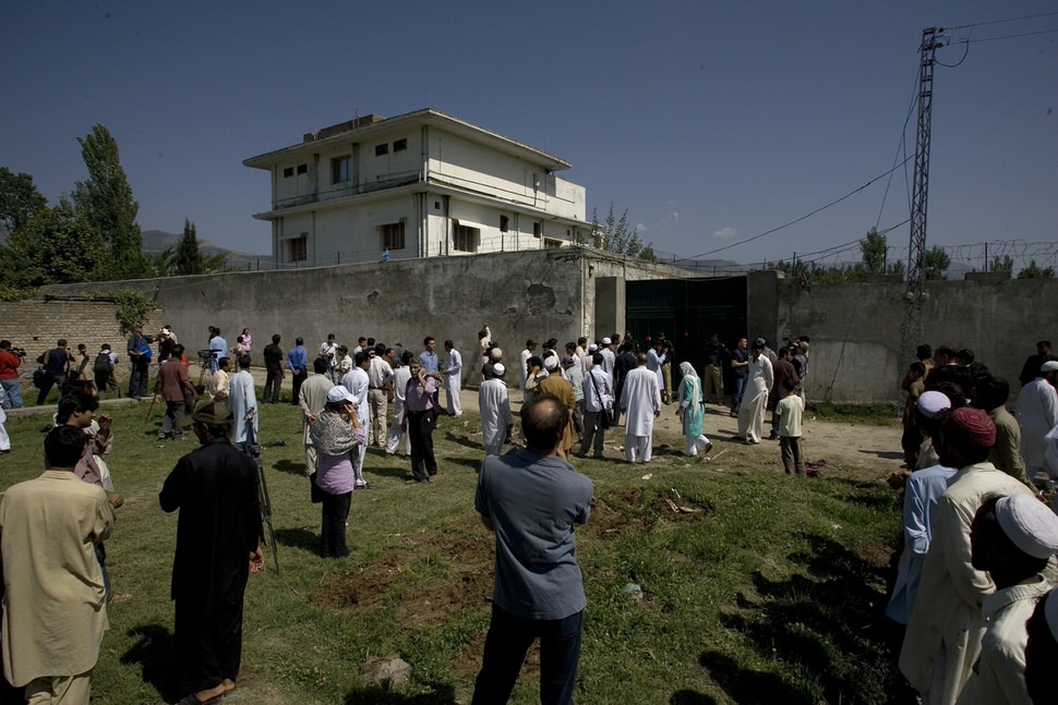 Local people outside the compound where Osama bin Laden was caught and killed late Monday, Abbottabad, Pakistan, May 3, 2011