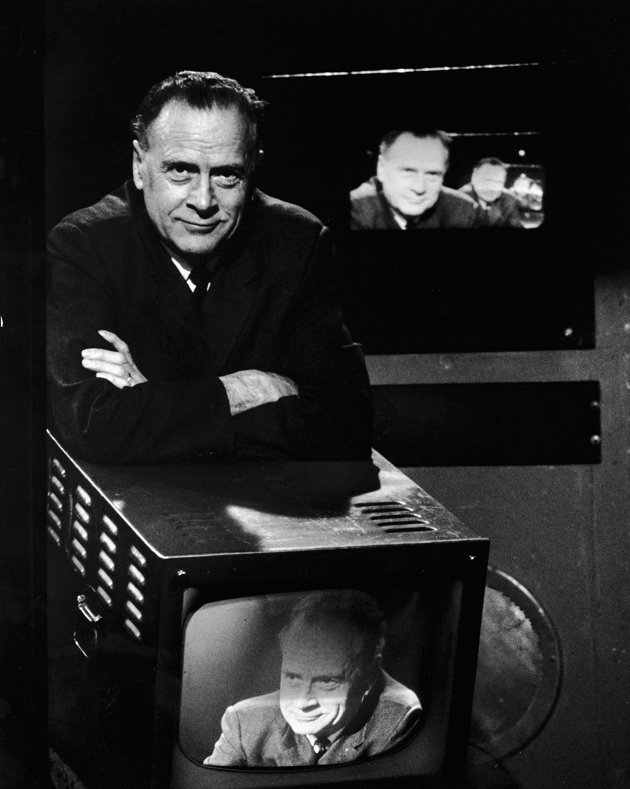 Marshall McLuhan with televisions showing his image, circa 1967
