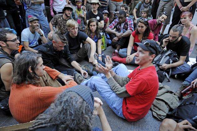 An instructor demonstrating how to break free of plastic hand restraints at the Occupy Wall Street occupation of Zuccotti Park, New York, October 9, 2011